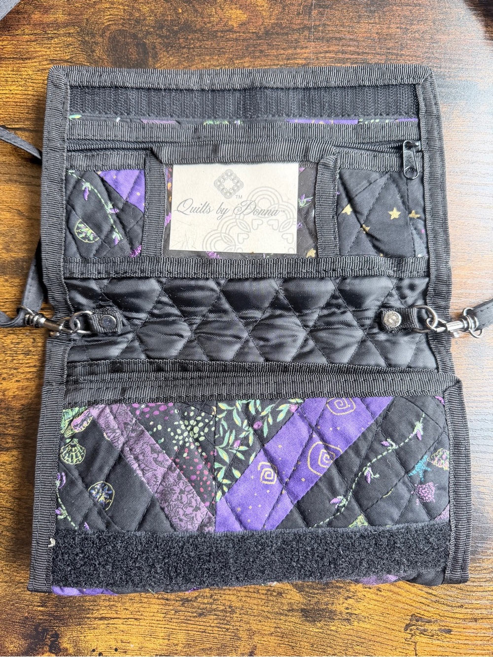 Handmade quilted crossbody purse by Donna Sharp in black, purple and green